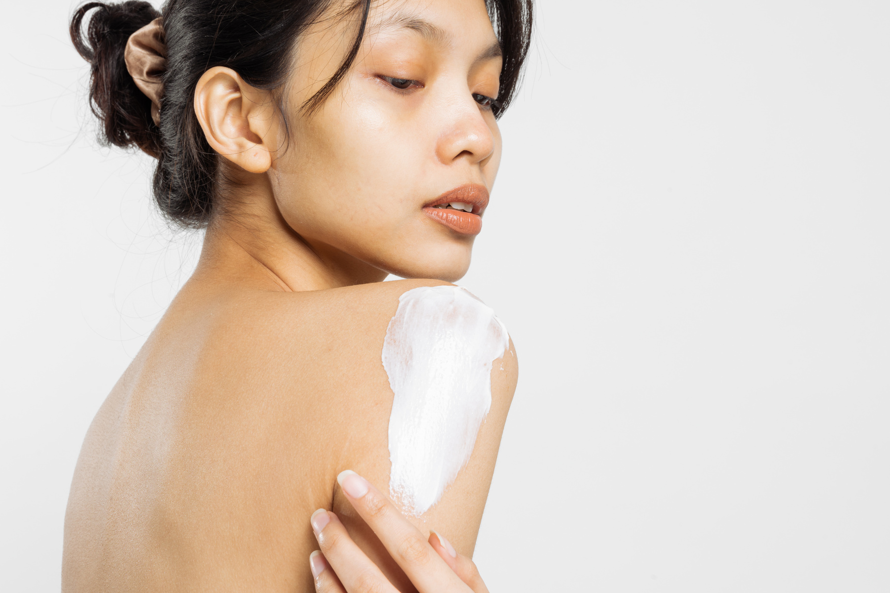 Portrait of a Woman with Lotion on Shoulder